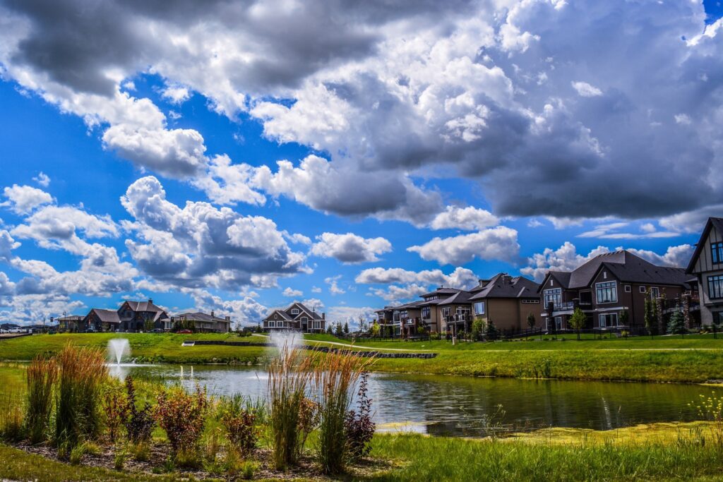 Calgary homes in summertime with rooftops and siding visible